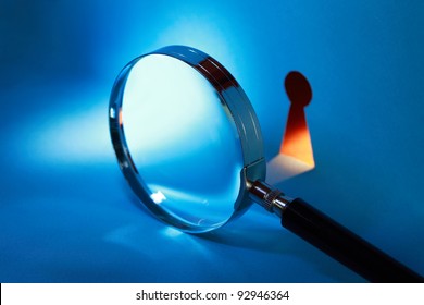 Spying Concept. Magnifying Glass Near Keyhole With Beam Of Light