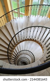 A spyral circular staircase leading downwards