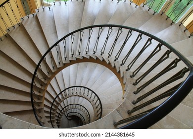 A spyral circular staircase leading downwards