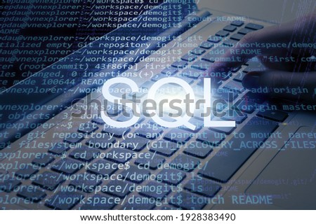 SQL inscription text against laptop and code background. Learn sql programming language,
