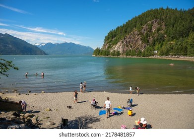Squamish BC, Canada - July 14th, 2022:  Summer crowds enjoy the beach at Porteau Cove Provincial Park, along Howe Sound near Squamish BC, Canada.