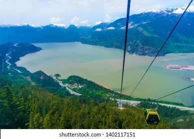 Squamish, BC / Canada - May 12, 2019: The scenic view of Sea to Sky Highway, Howe Sound and British Columbia  Mountains seen when riding the Sea to Sky Gondola in Squamish BC, Canada.