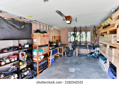 Squamish, British Columbia, Canada - April 2, 2016: An organized indoor house garage storage filled with personal stuff and junk stacked on shelves.
