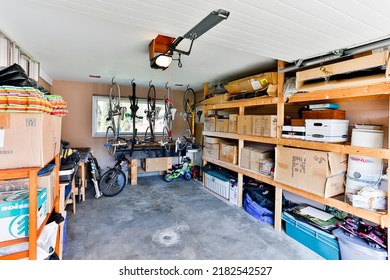 Squamish, British Columbia, Canada - April 2, 2016: An organized indoor house garage storage filled with personal stuff and junk stacked on shelves.