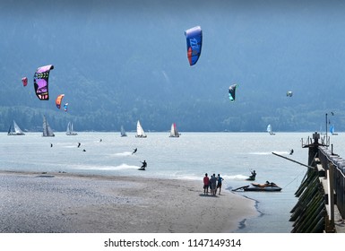     Squamish, British Columbia, Canada - July 28, 2018:  Kiteboarding, Squamish, British Columbia. Kiteboarders and windsurfers have almost guaranteed wind off Squamish Spit.