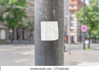 Square Blank Sticker Mockup On The Street Glued To The Pillar. White Textured Label Template.