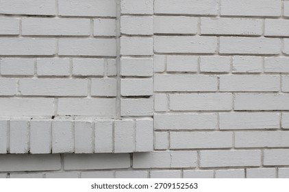 Square brick projection on a solid brick wall surface with copy space stock photo
