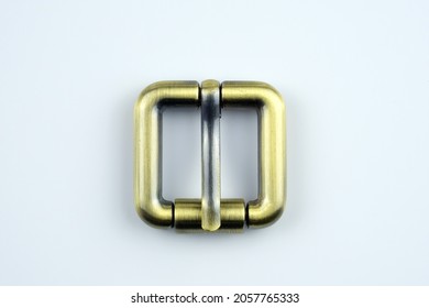 Square Bronze  Buckle With A Flat Tongue On A White Background. Metal Hardware For The Manufacture Of Belts. High Quality Sewing Accessories. Bag Buckle Top View. 