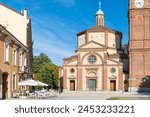 Square with church, bell tower and bar. Historic center of Legnano city, piazza San Magno (square Saint Magno) with the Basilica of San Magno (XVI century), Lombardy region, Italy