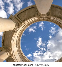 Square Circular structure supported by huge columns viewed on a sunny day
