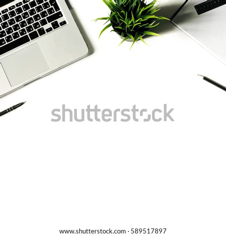 Square crop. White office desk with laptop keyboard and supplies. Laptop, notebook, pen, clips, pencil, plant and office supplies on white background. Flat lay, top view, mockup