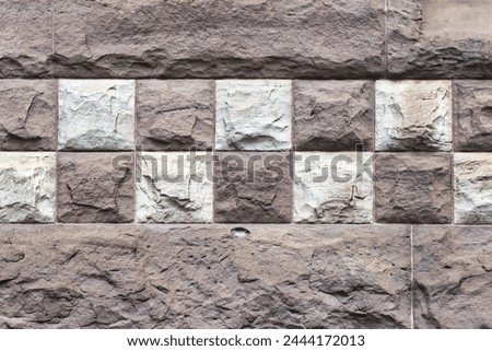 Square decorations in stone wall. Colonial architectural feature or detail in Old City Hall Building (1898), Toronto, Canada