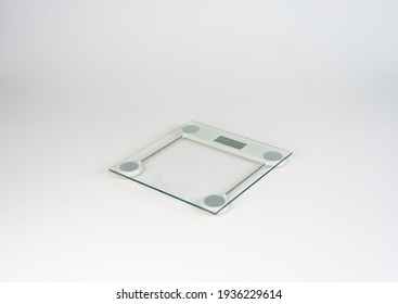 Square Digital Bathroom Scale Made Of White And Transparent Glass On Isolated White Background