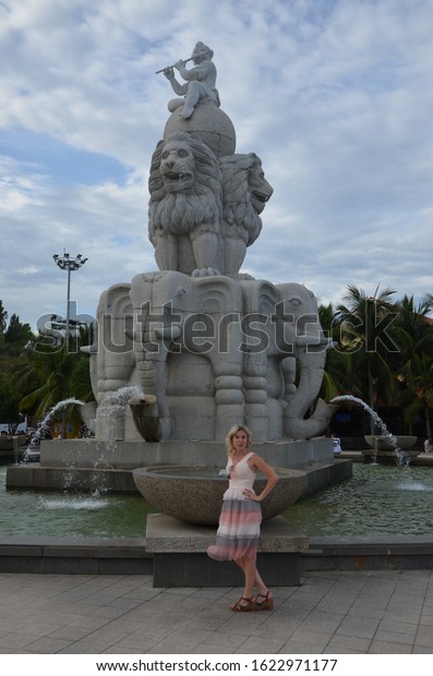 Square with\
fountains. Girl posing at the sculptural fountain. June 13, 2019.\
Nha Trang. Vietnam. Nha Trang. Vacation concept in Vietnam. Travel\
to Winperl. Entertainment\
island