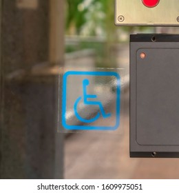 Square Frame Glass Door Of A Modern Building With Security Key Card Reader And Handicap Sign