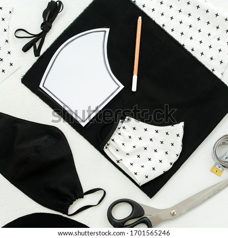 square framing of the image, top view of pieces of fabric, scissors and templet to make a protective mask