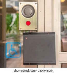 Square Glass Door Of A Modern Building With Security Key Card Reader And Handicap Sign