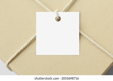 Square Hang Gift Tag On Kraft Gift Box. Birthday Present, Christmas Gift. 