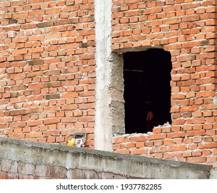 A Square Hole In The Red Brick Wall