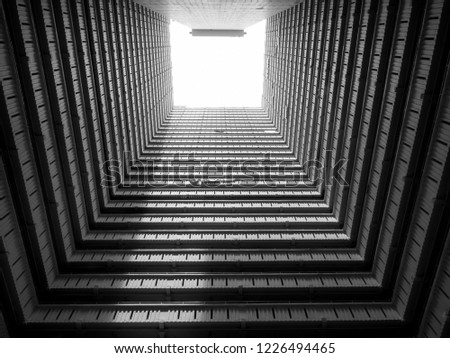 Square internal building respresenting the over population of Hong Kong and instense dense housing with all balconies facing in this housing estate