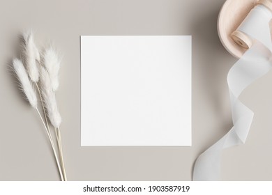 Square Invitation Card Mockup With A Lagurus On A Beige Table.