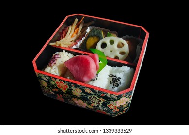 Square Japanese Bento Box With Rice And Vegetables, Isolated On Black Background