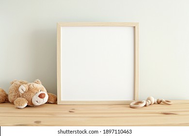 Square Nursery Art Frame Mockup, Empty Wooden Frame On Shelf In Kids Room Interior.