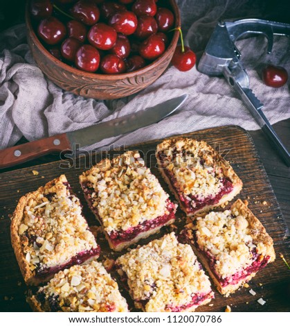 square pieces of cake crumble with cherry