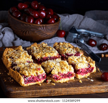 Similar – square pieces of cake crumble with cherry