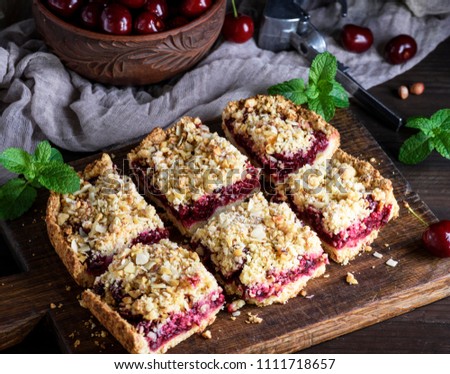 Similar – square pieces of cake crumble with cherry