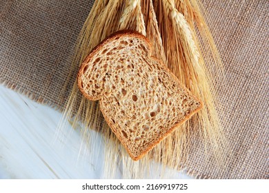 Square Pieces Of Toast Rye Bread And Ears Of Dry Wheat