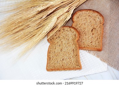 Square Pieces Of Toast Rye Bread And Ears Of Dry Wheat