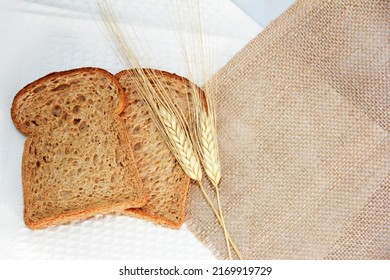 Square Pieces Of Toast Rye Bread And Ears Of Dry Wheat