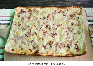 Square Pizza Thin Crust On Wooden Plate Serve For Eat At Restaurant In Baden-Württemberg, Germany