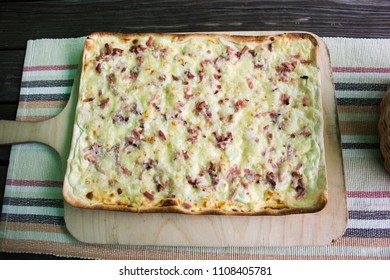 Square Pizza Thin Crust On Wooden Plate Serve For Eat At Restaurant In Baden-Württemberg, Germany