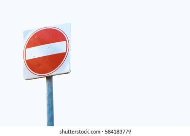 A square red sign with a white bar indicating 'NO ENTRY' on a grey metal post against white background.