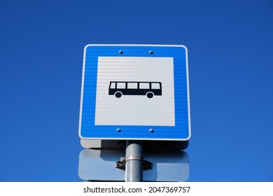 Square Shaped Blue Colour Bus Stop Sign Board In A Bus Station In Budapest Suburb, Hungary With Blue Sky Background