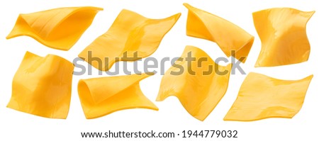 Square slices of processed cheese isolated on white background with clipping path