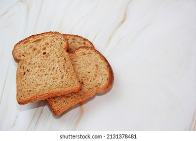 Square Slices Of Toasted Dark Rye Bread