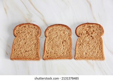 Square Slices Of Toasted Dark Rye Bread