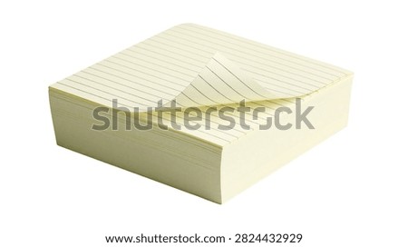 Square stack of light yellow lined sticky notes with one page curled up