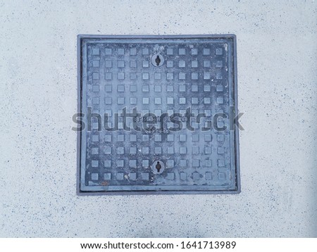 Square steel manhole cover with cement floor  