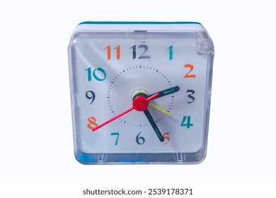 Square table clock with alarm clock, small electronic bedside compact alarm clock, quartz tabletop isolate close-up.