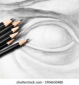 square view set black graphite pencils hand  drawn academic drawing plaster cast eye close up