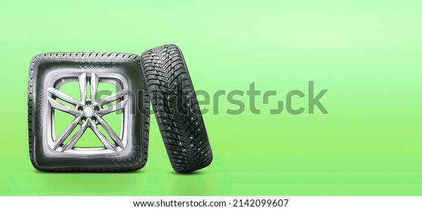 a square wheel from a car on a green summer\
background. a concept for tire repair, wheel repair or tire sales.\
empty space copy space