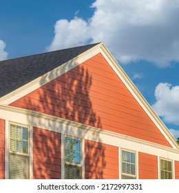 Square White Puffy Clouds House Exterior With Rustic Vinyl Wood Siding And Chimney Post Wi