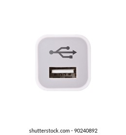 A square white USB socket port with USB signage.