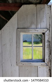 Square window in rustic barn door