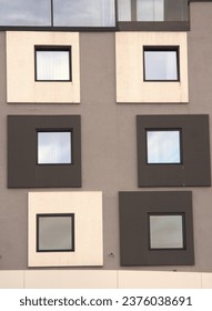 Square windows surrounded with black and beige squares