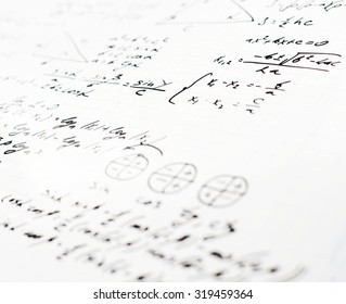 Squared sheet of paper filled with trigonometry math equations and formulas as a background composition with the shallow depth of field